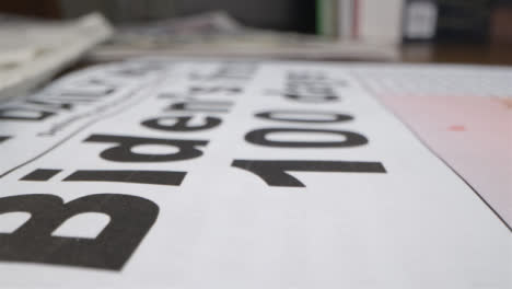 Tracking-Close-Up-Biden-First-100-days-Newspaper-Headline