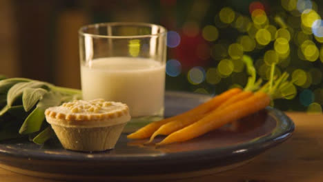 Sliding-Extreme-Close-Up-Shot-of-Sage-Carrots-Mince-Pie-and-Glass-of-Milk-On-Plate