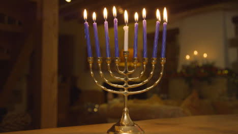 Close-Up-Shot-of-Candles-On-Menorah-Burning-During-Hanukkah-Celebrations