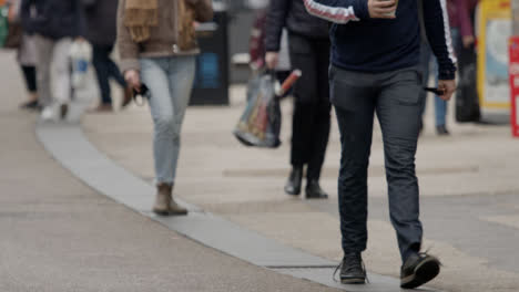 Long-Shot-of-People-Walking-Down-Queen-Street-In-Oxford-England