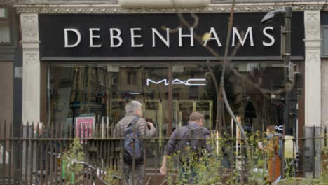 Long-Shot-of-People-Walking-Past-Debenhams-Department-Store-In-Oxford-England