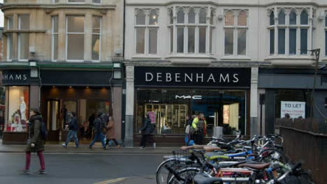 Wide-Shot-of-People-Walking-Past-Debenhams-Department-Store-In-Oxford-England