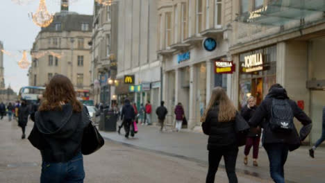 Tracking-Shot-of-People-Walking-Down-a-Busy-Street-In-Oxford-England
