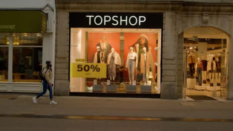 Wide-Shot-of-People-Walking-Past-TopShop-Store-In-Oxford-England