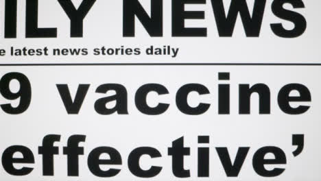 Dolly-Out-Extreme-Close-Up-Shot-of-Covid-19-Vaccine-News-Article-On-Computer-Screen