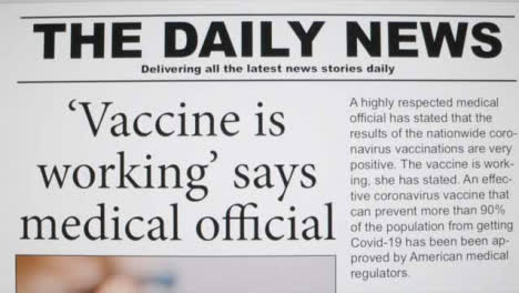 Close-Up-Shot-of-Scrolling-Covid-19-Vaccine-News-Article-On-Computer-Screen