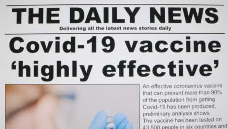 Dolly-Out-Close-Up-Shot-of-Effective-Covid-19-Vaccine-Approval-News-Article-On-a-Computer-Screen