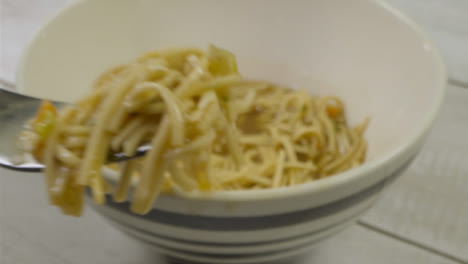 Sliding-Extreme-Close-Up-Shot-Approaching-a-Bowl-of-Noodles