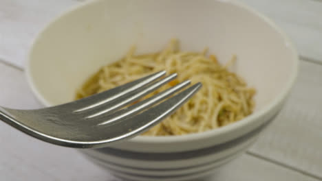 Sliding-Extreme-Close-Up-Shot-Following-Fork-Into-Bowl-of-Noodles