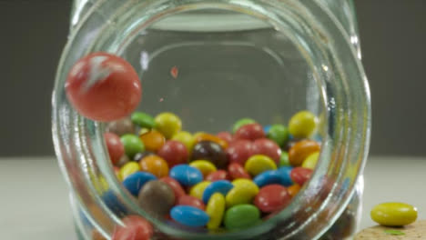 Sliding-Extreme-Close-Up-Shot-Into-a-Jar-of-Colourful-Chocolates