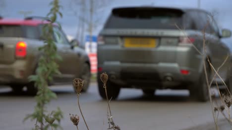 Defocused-Wide-Shot-of-Car-Driving-Into-COVID-Testing-Site