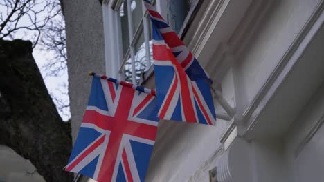 Handheld-Close-Up-Shot-of-United-Kingdom-Flags-Swaying