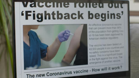 Sliding-Close-Up-of-Coronavirus-Vaccine-News-Article-On-Laptop-Screen