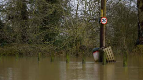Long-Shot-of-Submerged-Electrical-Pole-In-Flooded-Road-