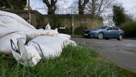 Wide-Shot-of-Sandbags-On-Roadside-In-Flooded-Village
