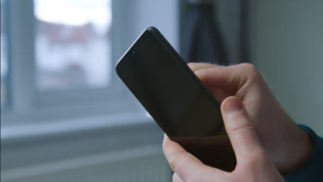 Close-Up-Shot-of-Male-Hands-Cleaning-a-Phone-Screen-with-Anti-Bacterial-Wipe