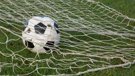 Medium-Shot-of-Soccer-Ball-Landing-In-Goal-Net