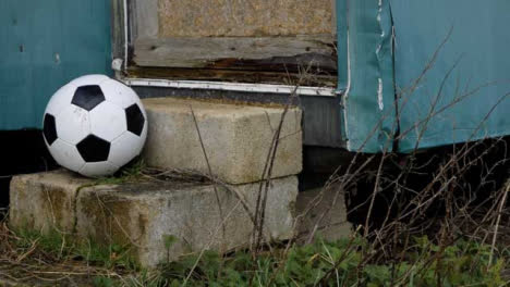 Medium-Shot-of-Soccer-Player-Placing-Soccer-Ball-On-Concrete-Block
