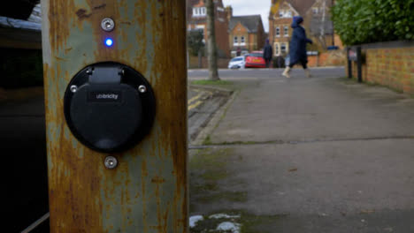 Pedestal-Shot-Rising-Up-and-Looking-at-On-Street-Electric-Car-Charging-Point