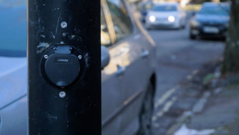 Handheld-Close-Up-of-On-Street-Electric-Car-Charging-Point
