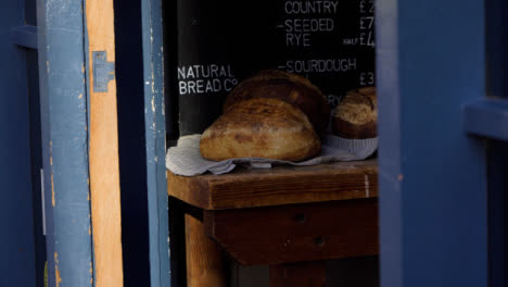 Handheld-Shot-of-Organic-Produce-Stores-Bread-Display-