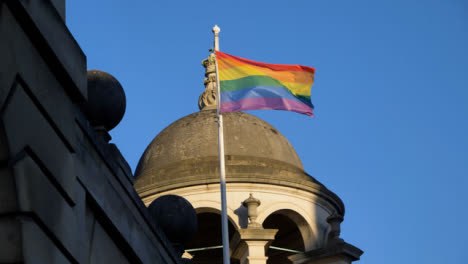 Low-Angle-Handheld-Shot-Looking-Up-at-Pride-Flag-