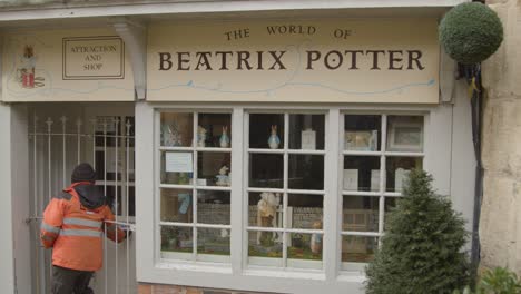Medium-Shot-of-Postal-Worker-Posting-Letters-to-Beatrix-Potter-Museum