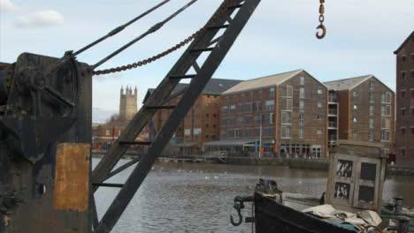Tracking-Shot-Past-Crane-at-Industrial-Docks