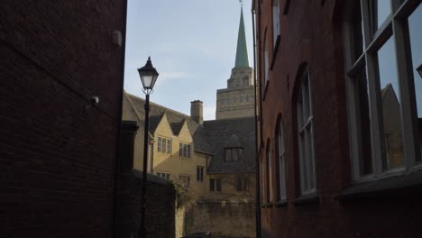 Tracking-Shot-Through-Alley-Looking-at-Nuffield-College-Spire