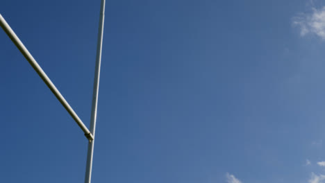 Low-Angle-Shot-Looking-Up-at-Rugby-Posts-Swaying-In-Wind-