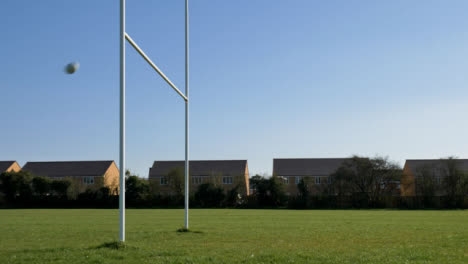 Wide-Shot-of-Rugby-Ball-Flying-Through-Rugby-Posts
