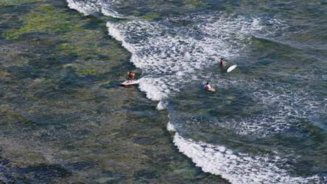 High-Angle-Long-Shot-of-People-In-Ocean-at-Echo-Beach-Learning-to-Surf