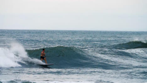 Handheld-Long-Shot-of-Surfer-Riding-a-Wave-