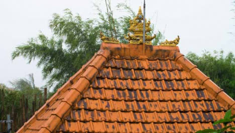 Long-Shot-of-Rain-Falling-On-Temple-Roof