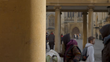 Defocused-Shot-of-Pedestrians-Walking-In-Abbey-Churchyard