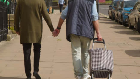 Tracking-Shot-Following-Senior-Couple-Walking-Down-Great-Pulteney-Street