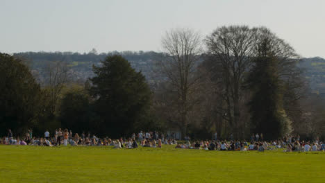 Long-Shot-of-Pedestrians-On-Royal-Crescent-Green