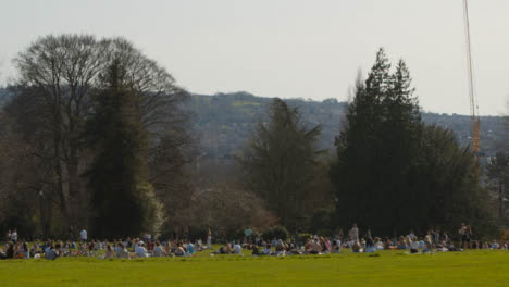 Long-Shot-of-Large-Number-of-Pedestrians-On-Royal-Crescent-Green