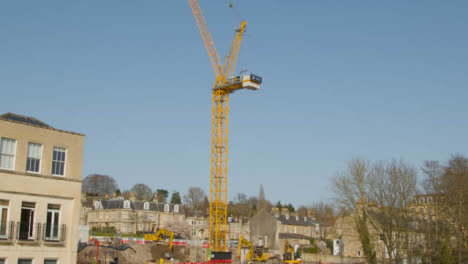 Tilting-Shot-of-a-Crane-at-Construction-Site