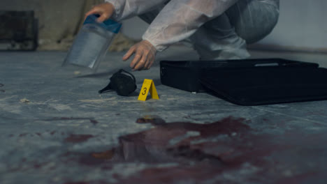 Wide-Shot-of-Forensic-Placing-Evidence-Tag-Next-to-High-Heel-at-Crime-Scene