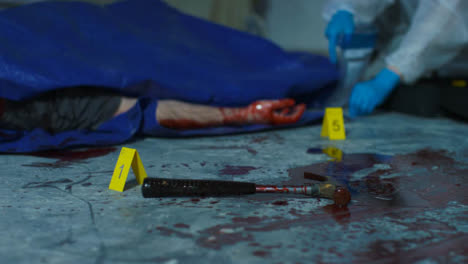 Sliding-Close-Up-of-a-Bloody-Hammer-with-Forensic-Placing-Evidence-Tag-In-Background-