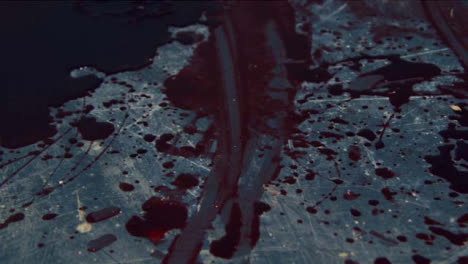 Extreme-Close-Up-Gimbal-Shot-of-Bloody-Knife-at-Crime-Scene