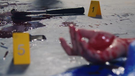 Pull-Focus-Shot-from-Bloody-Hand-to-Hammer-at-Crime-Scene