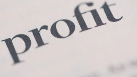 Sliding-Extreme-Close-Up-Shot-of-a-Newspaper-Financial-Sub-Heading