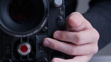 Close-Up-Shot-of-Person-Hitting-Record-Button-On-RED-Dragon-Cinema-Camera
