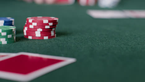 Sliding-Shot-of-Pair-of-Cards-and-Poker-Chips-