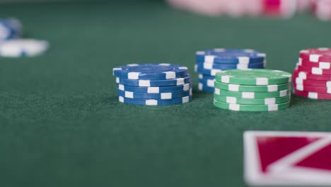 Sliding-Shot-of-Pair-of-Cards-and-Poker-Chips-