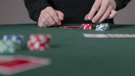 Long-Shot-of-Poker-Player-Thinking-and-Placing-Bet