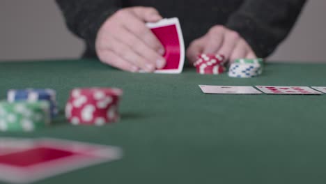 Long-Shot-of-Poker-Player-Thinking-and-Placing-Bet