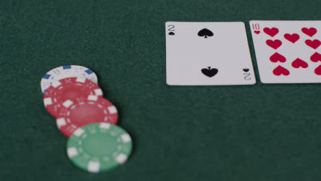 Tracking-Close-Up-Shot-from-Cards-to-Chips-Being-Bet